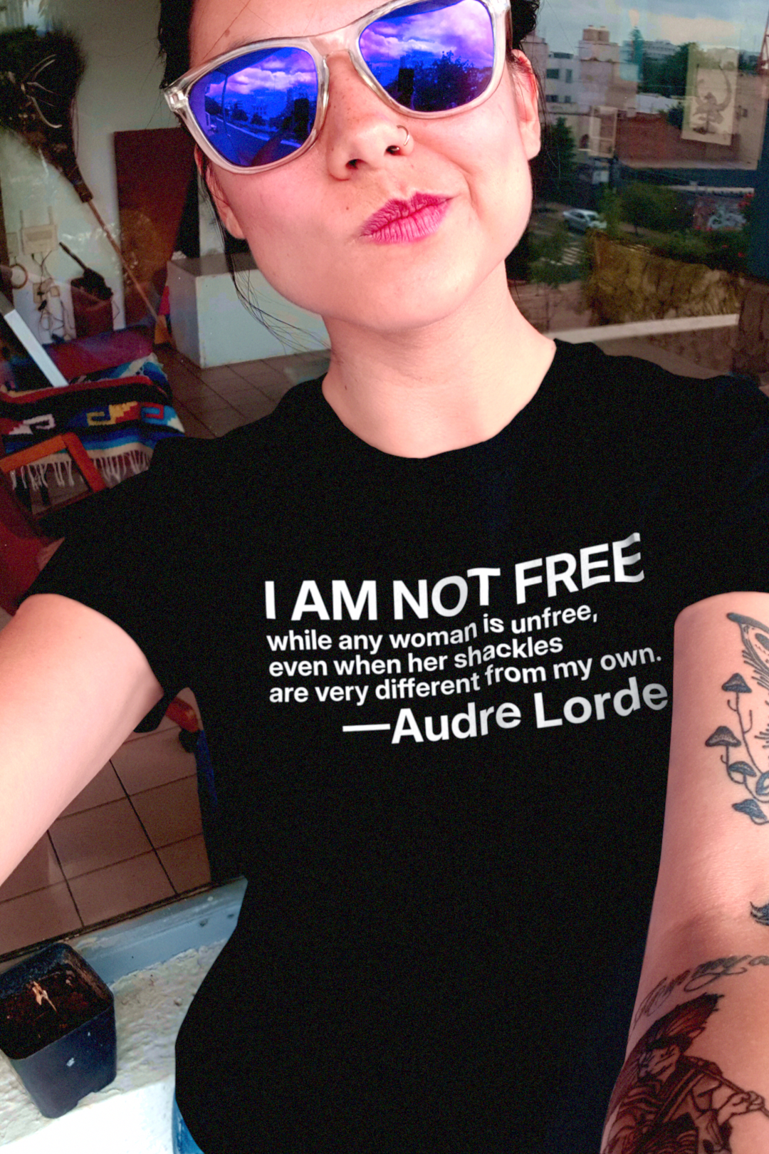 Audre Lorde: I am not free while any woman is unfree ... Relaxed Fit Women's Tee | 5 graphic colors available