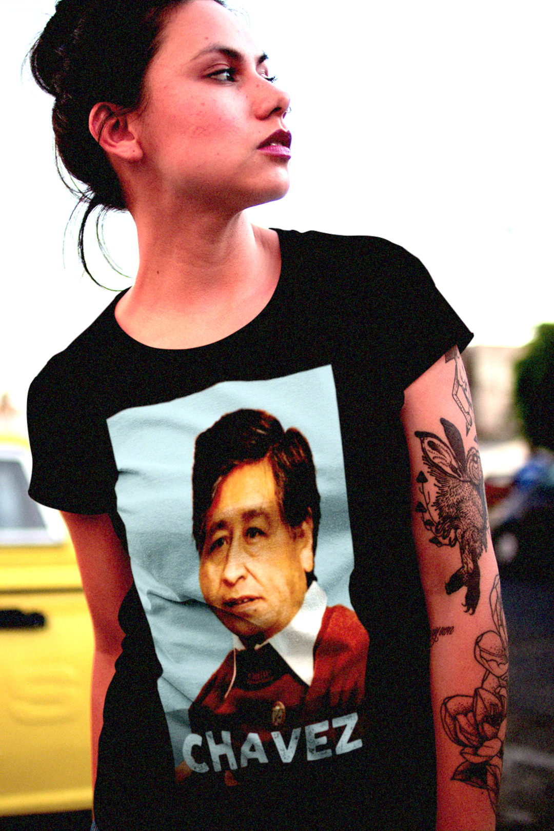 Latina woman wearing a black Cesar Chavez relaxed fit women's tee shirt. Great gift for Chicana labor activists. 