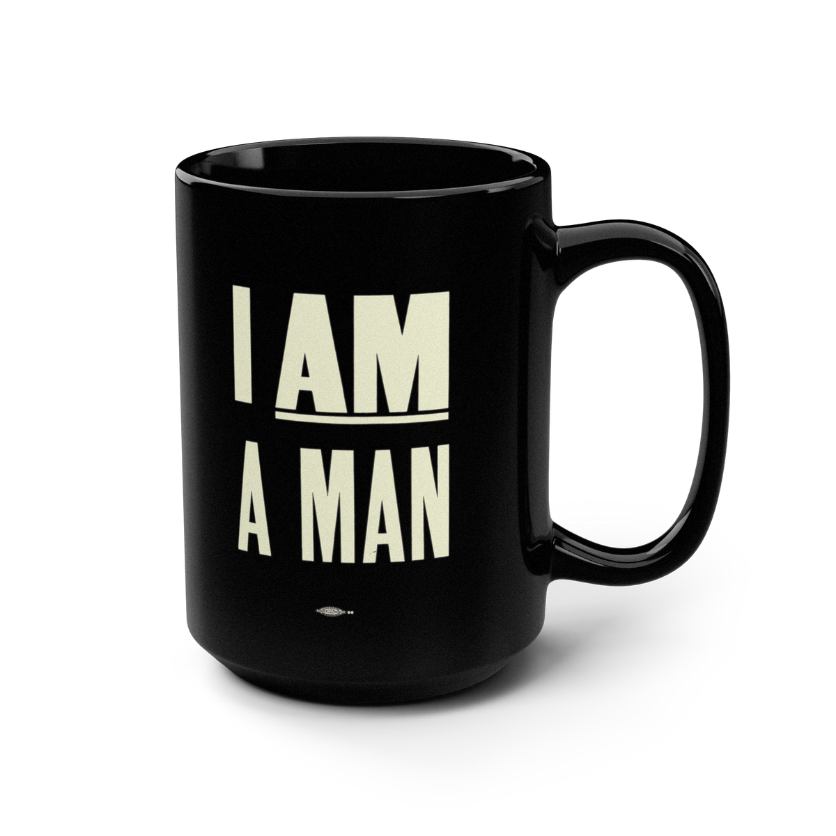 A black ceramic mug with the phrase 'I AM A MAN' printed in bold cream-colored block letters on the front. 1968 Memphis Sanitation Strike.