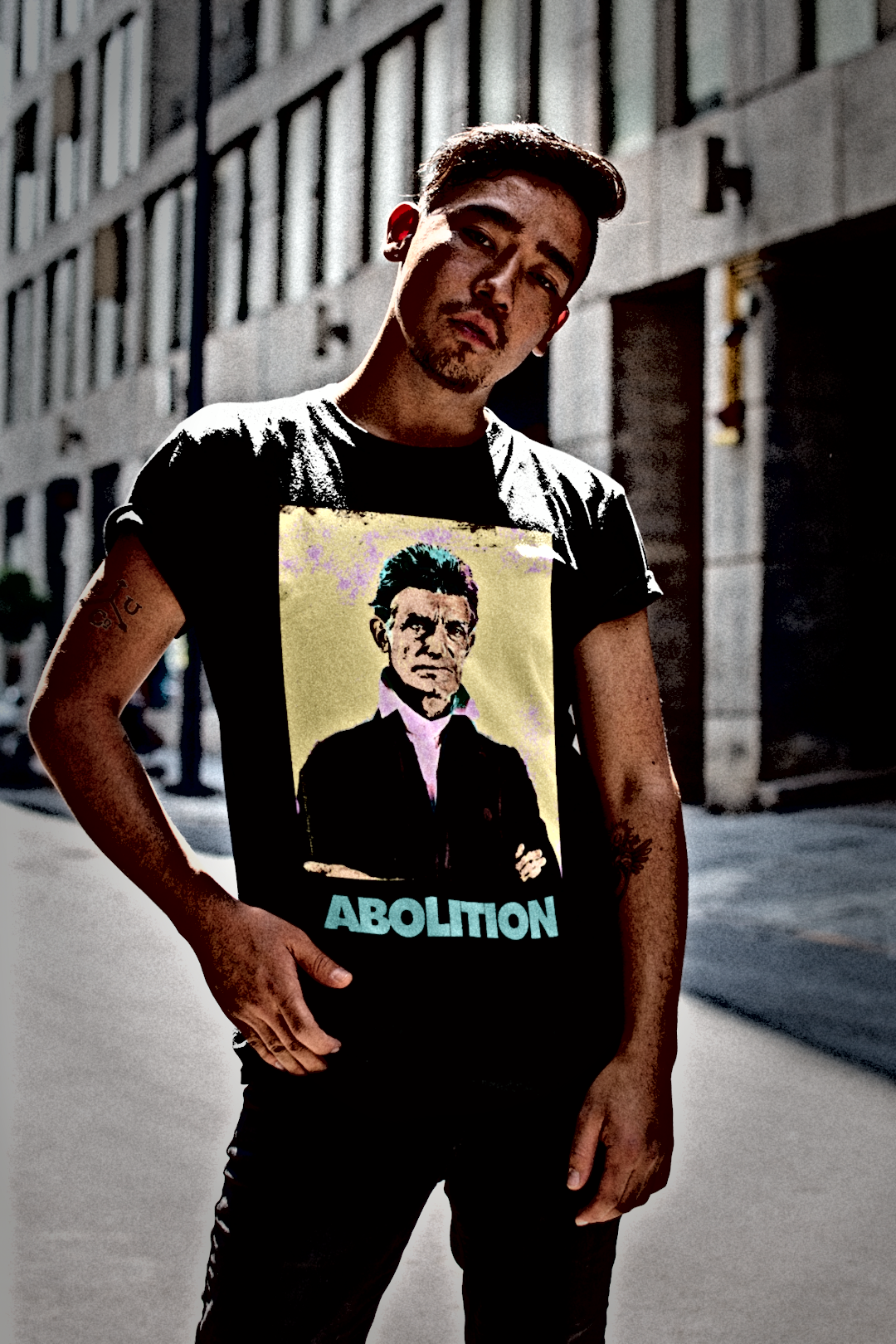 Asian Hipster Man on City Street wearing Basic Black T-Shirt: John Brown, militant abolitionist who fought slavery with uncompromising zeal and sacrifice. Cotton Bella+Canvas 3001 #EUTC