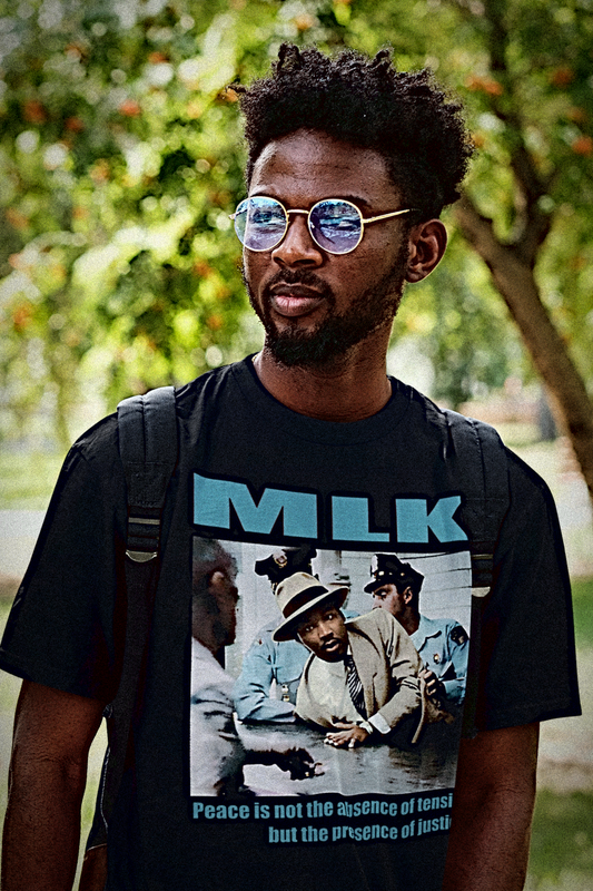 MLK Montgomery Arrest | Peace is not the absence of tension | blue | Basic T-Shirt
