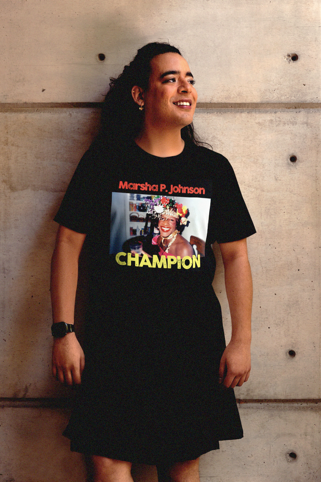 Trans woman in black kilt against contemporary concrete wall wearing a Basic Black T-Shirt depicting Marsha P. Johnson.

Trans activist and Stonewall veteran Marsha P. Johnson stood at the front lines of queer liberation. With joy, defiance, and radical love, she helped ignite the modern LGBTQ+ rights movement. 

Great gift for the drag queens, and the #trans and #LGBTQ activists in your life. 

Bella+Canvas 3001 Basic T-Shirt #EUTC 
