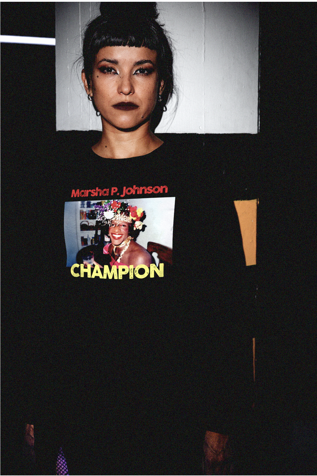 Goth punk chick in parking garage wearing a  Long Sleeve Jersey depicting Marsha P. Johnson

Trans activist and Stonewall veteran Marsha P. Johnson (1945–1992) stood at the front lines of queer liberation. With joy, defiance, and radical love, she helped ignite the modern #LGBTQ+ rights movement.

Gift for the drag queen or trans activist in your life. Bella+Canvas 3501 | Long Sleeve Jersey  #Transrightarehumanrights #EUTC