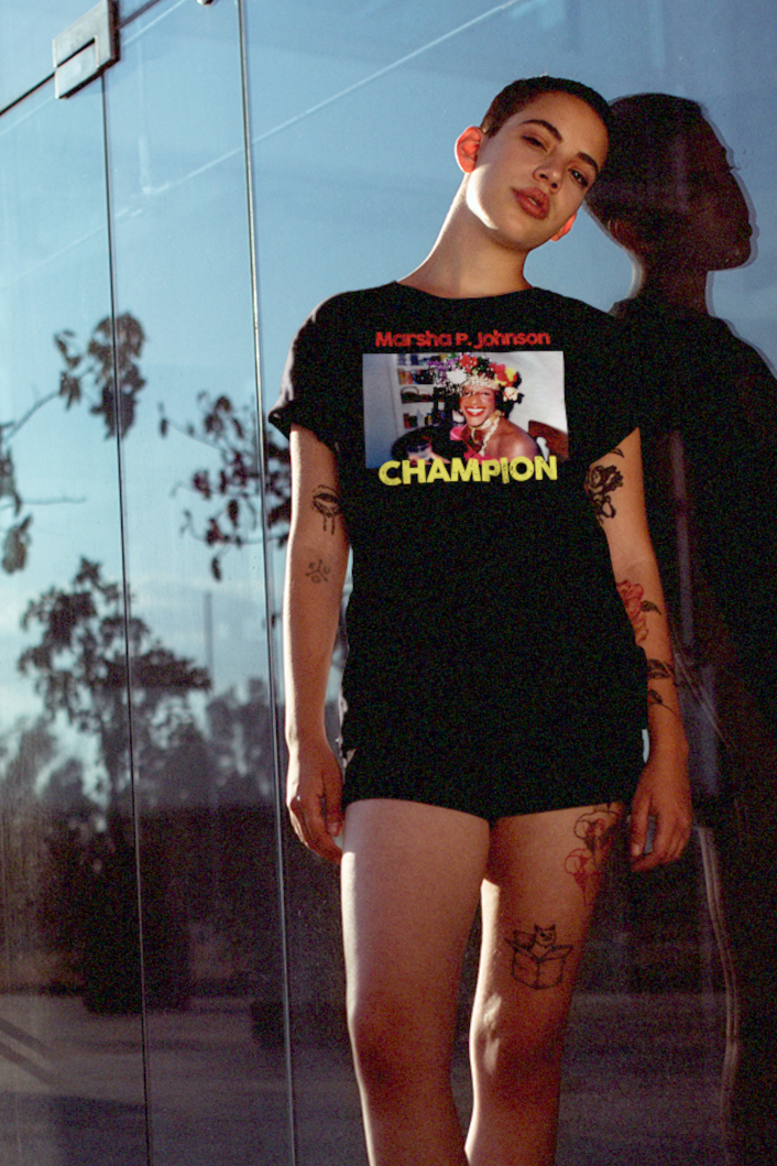 Tattooed buzzcut queer woman out for a run wearing a Basic Black T-Shirt depicting Marsha P. Johnson.

Trans activist and Stonewall veteran Marsha P. Johnson stood at the front lines of queer liberation. With joy, defiance, and radical love, she helped ignite the modern LGBTQ+ rights movement. 

Great #gift for the drag queens, and the #trans and #LGBTQ activists in your life. 

Bella+Canvas 3001 Basic T-Shirt #EUTC 