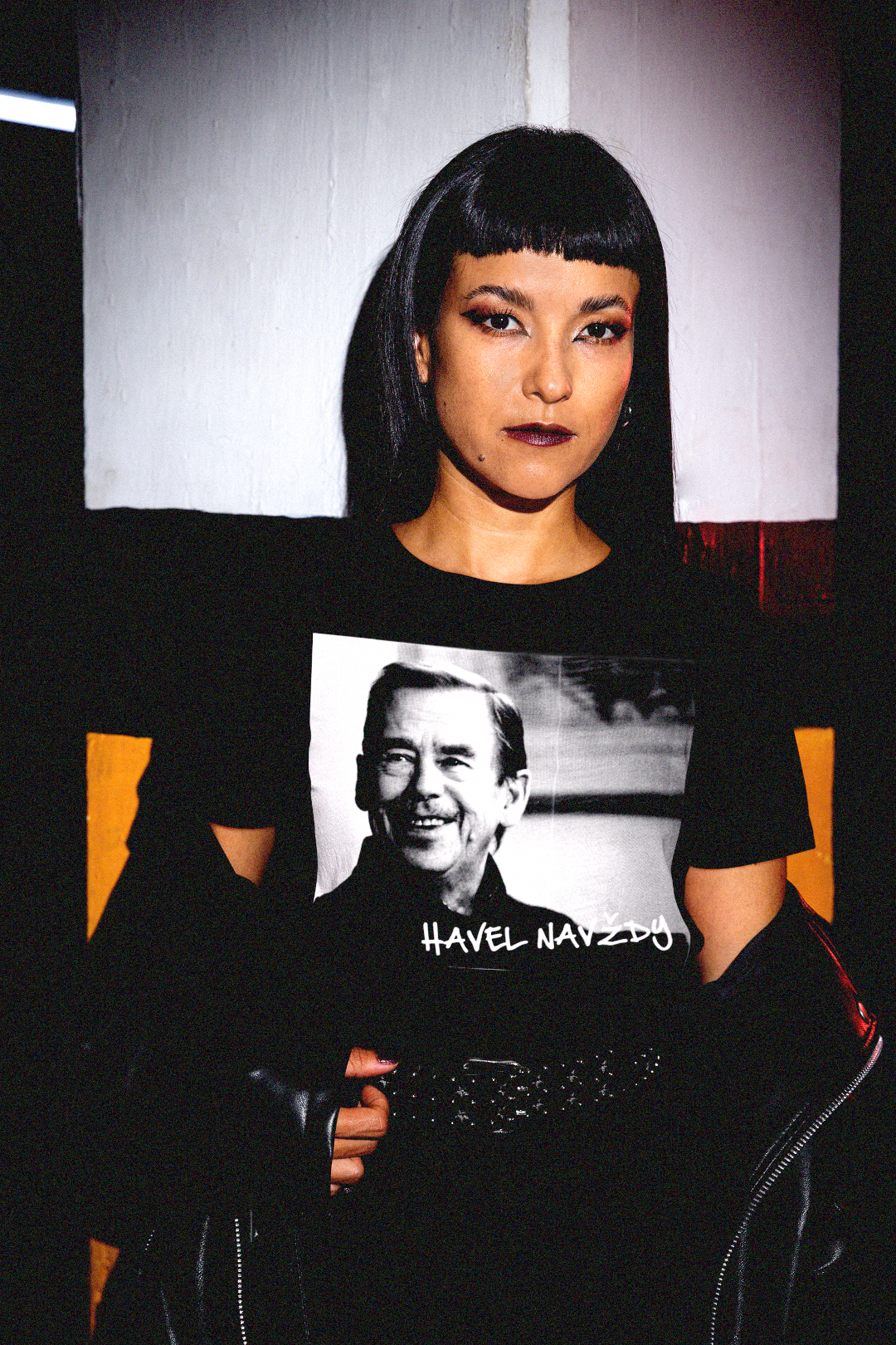 Goth, emo woman wearing a black Vaclav Havel t-shirt in a parking garage. Great gift for the dissident president in your life. 