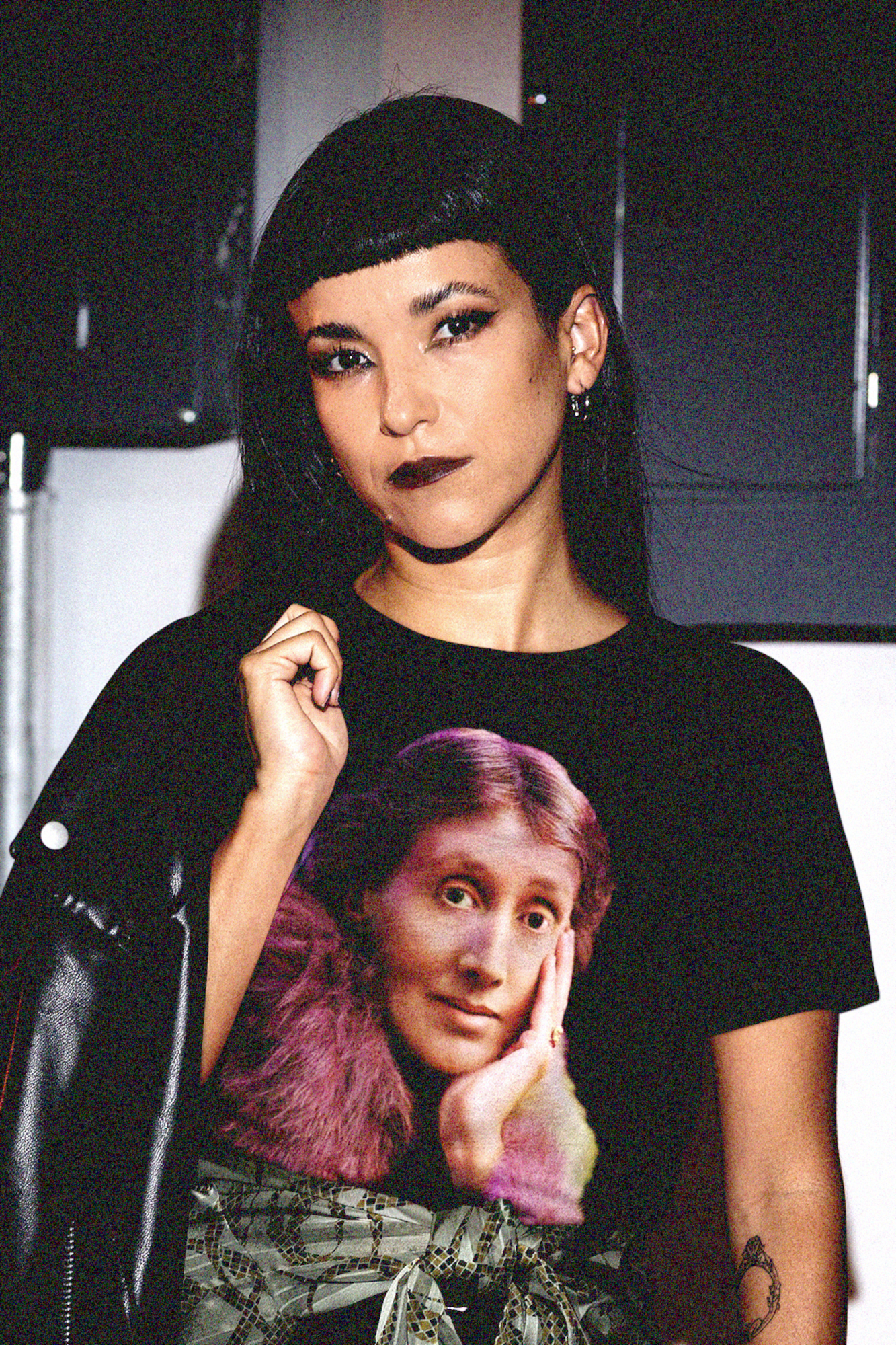 Goth punk woman wearing Basic black t-shirt of technicolor portrait of Virginia Woolf. She made literature new—stream-of-consciousness, fractured time, inner lives spilling across the page.

Perfect gift for your book club friend or the English major in your life. 
Bella+Canvas 3001 | Basic T-Shirt
