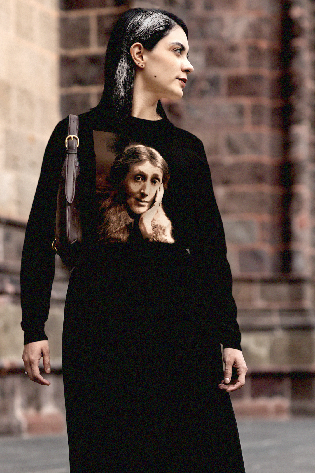 Gothesque woman grad student wearing a long sleeve jersey with a sepia portrait of Virginia Woolf. She made literature new—stream-of-consciousness, fractured time, inner lives spilling across the page. With novels like Mrs. Dalloway and To the Lighthouse, she redefined modernism not as escape but as immersion. 

Photo shows fit and style. Perfect gift for your book club fit or the English major in your life. Bella+Canvas 3501 #EUTC